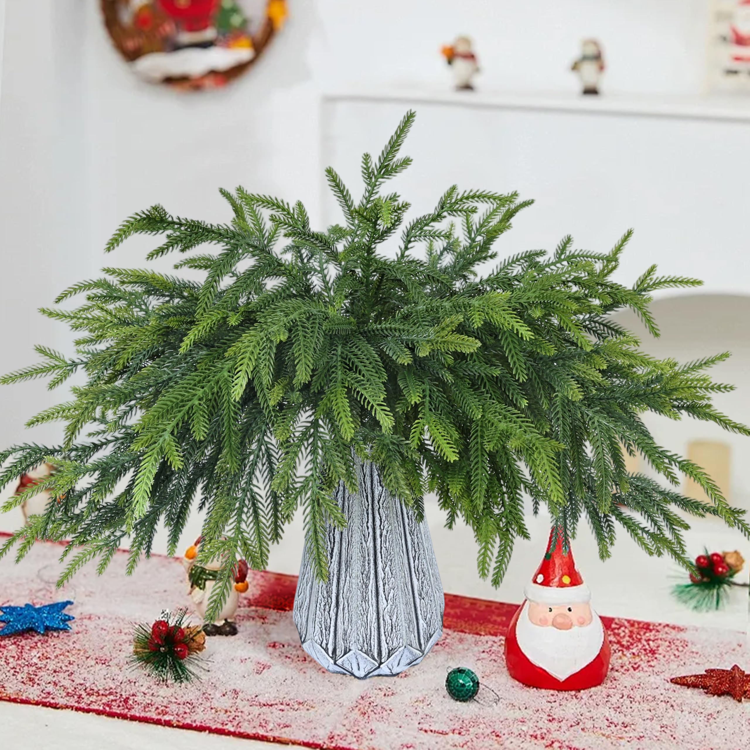 MDSTBN arranged pine branches in clear vase showing easy decor upgrade benefit
