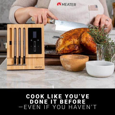MEATER Block with four probes inserted monitoring multiple cuts, ensures even cooking