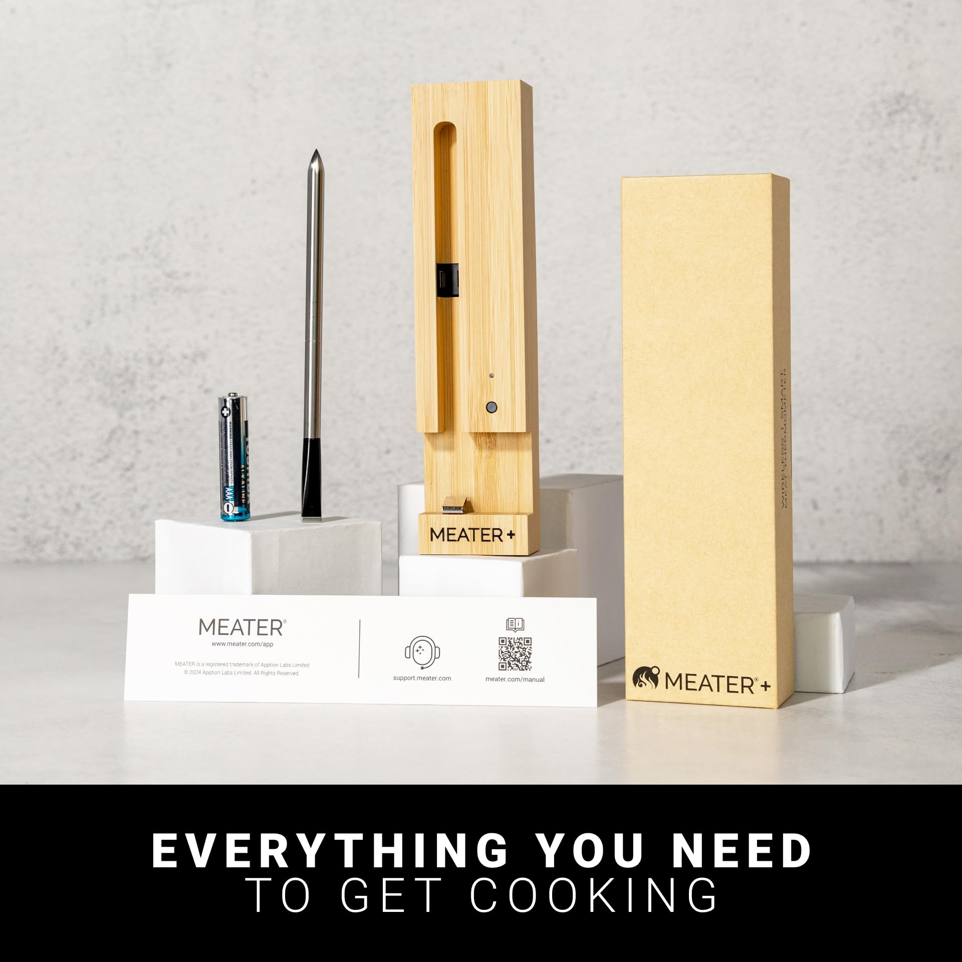 MEATER Plus probe held in a hand for size comparison, demonstrates compact portability