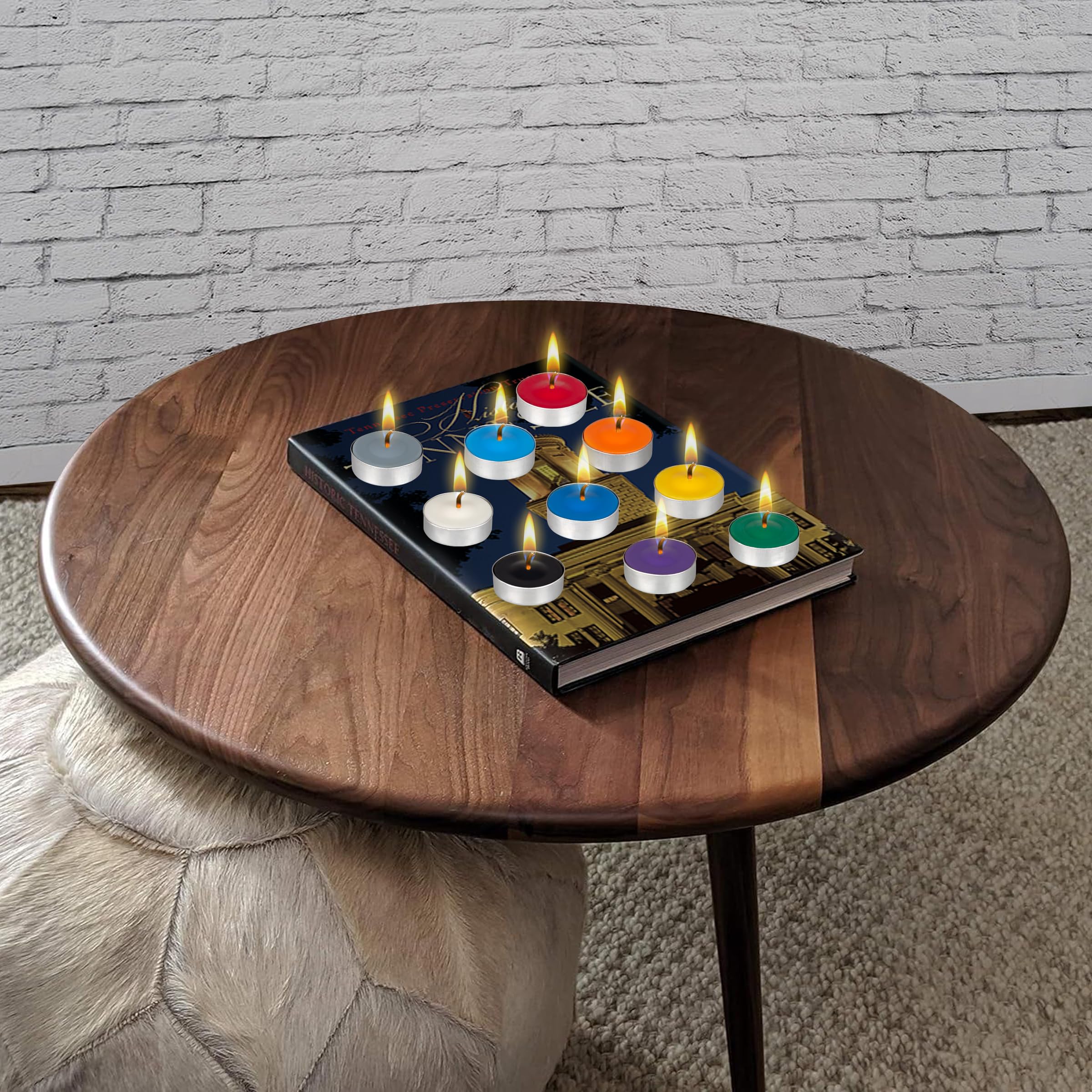 MEGA CANDLES held in hand to show compact 1.5 inch tea light scale