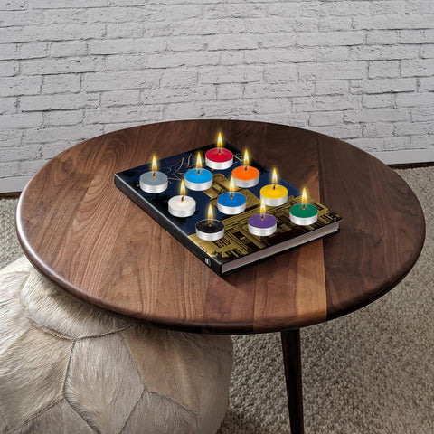 MEGA CANDLES held in hand to show compact 1.5 inch tea light scale