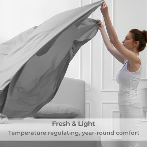 Mellanni flat sheet and two pillowcases laid flat showing stripe pattern and smooth finish
