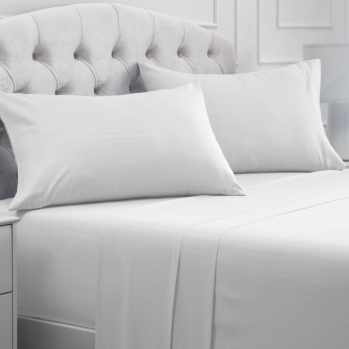Mellanni front packaging showing striped white set and clear sizing benefits