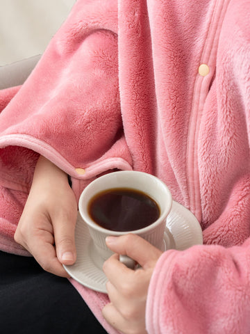 Mellowdy used on airplane seat as cozy travel blanket and pillow substitute