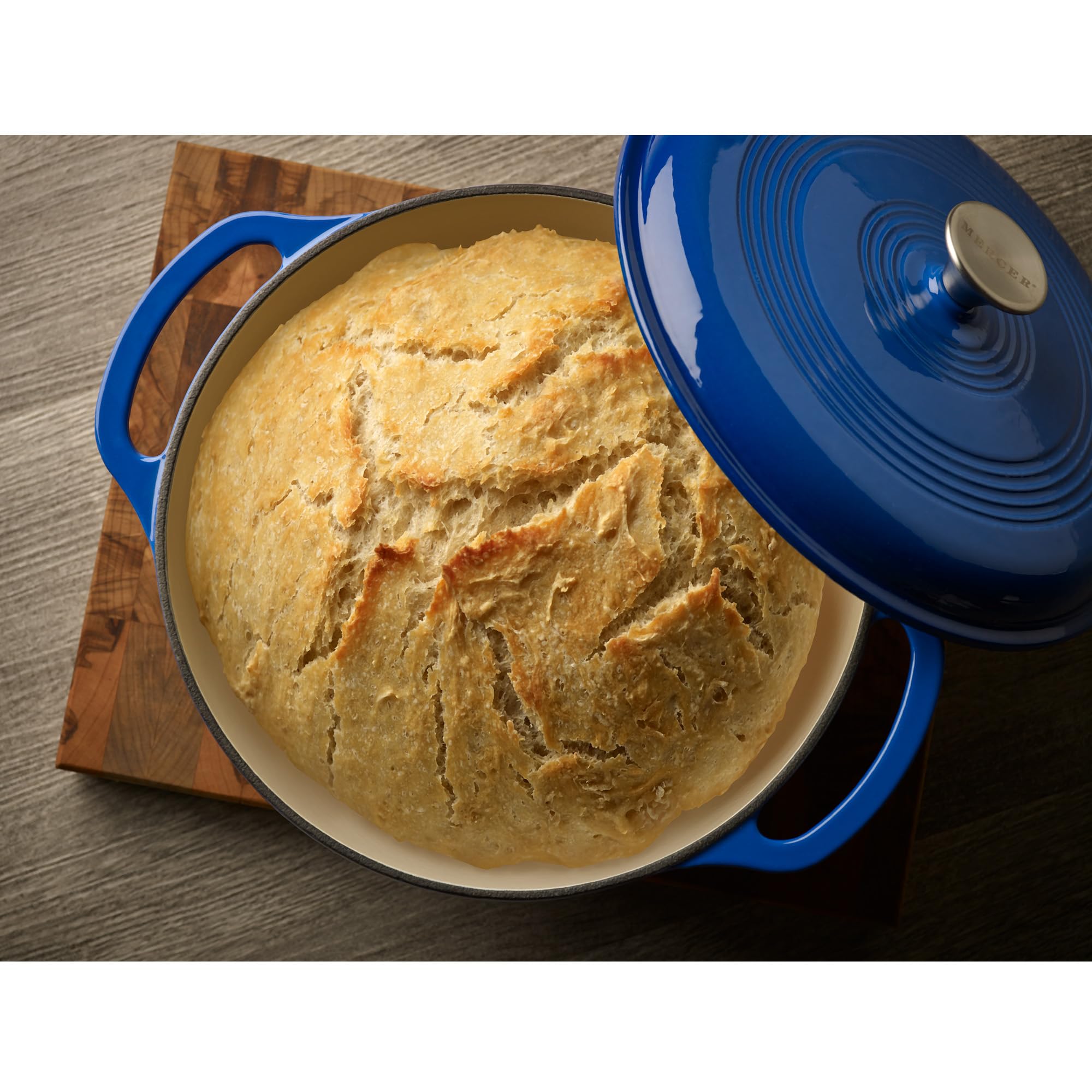 Mercer Culinary Dutch oven next to measuring cup for size comparison and capacity clarity