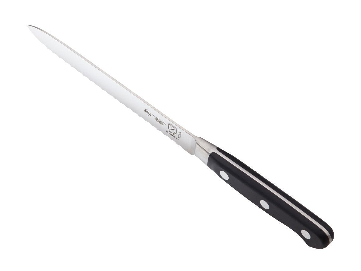 Mercer Culinary Renaissance next to ruler on cutting board showing compact 5-inch scale