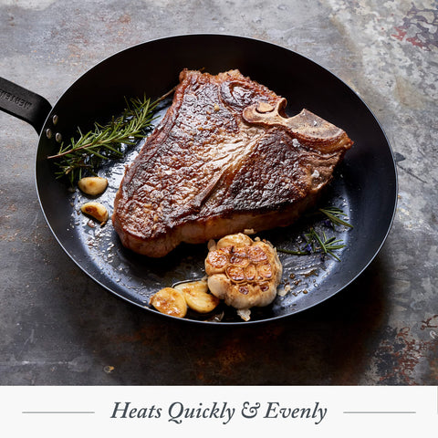 Merten & Storck skillet held in hand for scale to show lightweight, easy-to-handle design