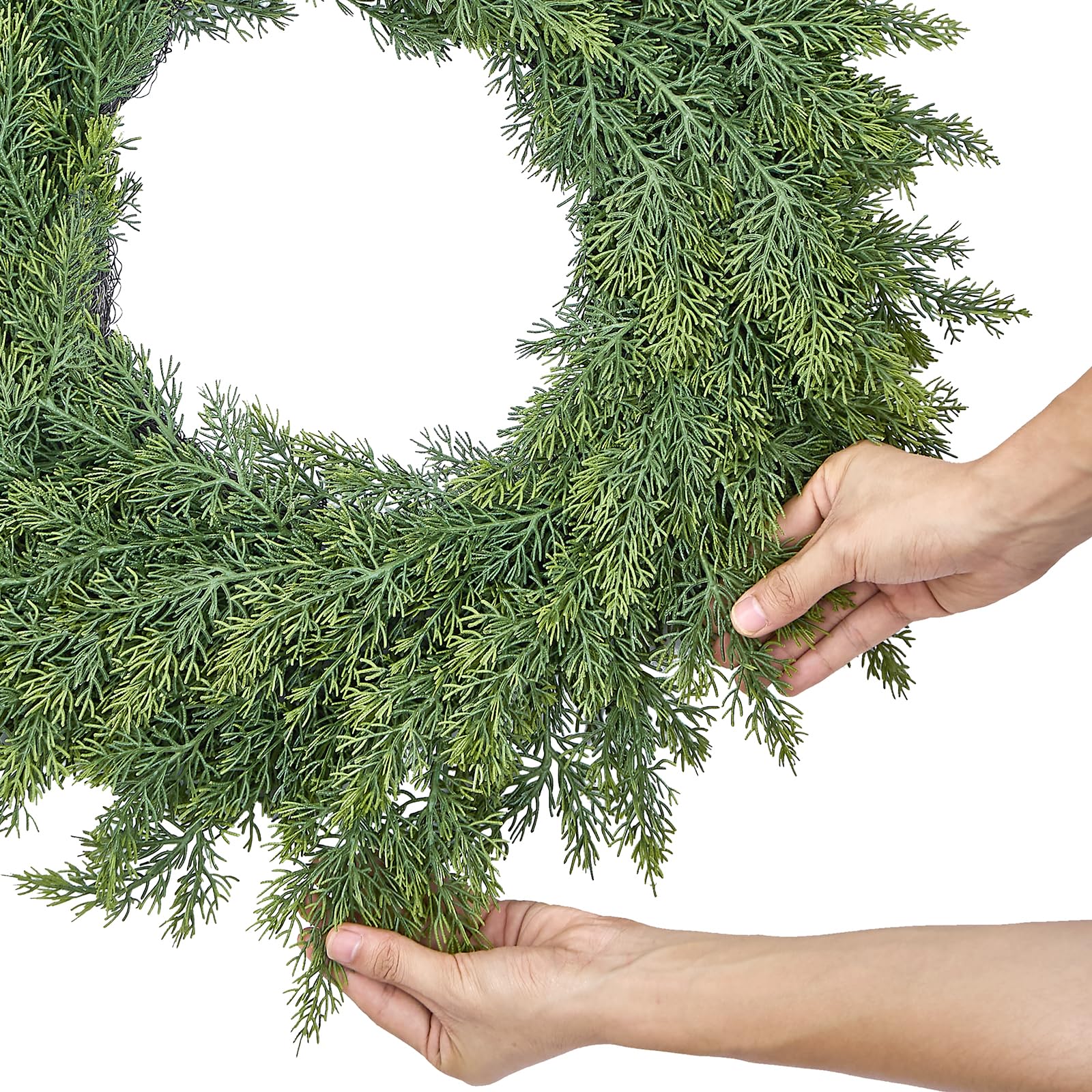 MEUIS hands fluffing wreath demonstrating easy shaping to restore lush form