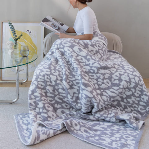MH MYLUNE HOME draped on bed highlighting decorative layering and comfort