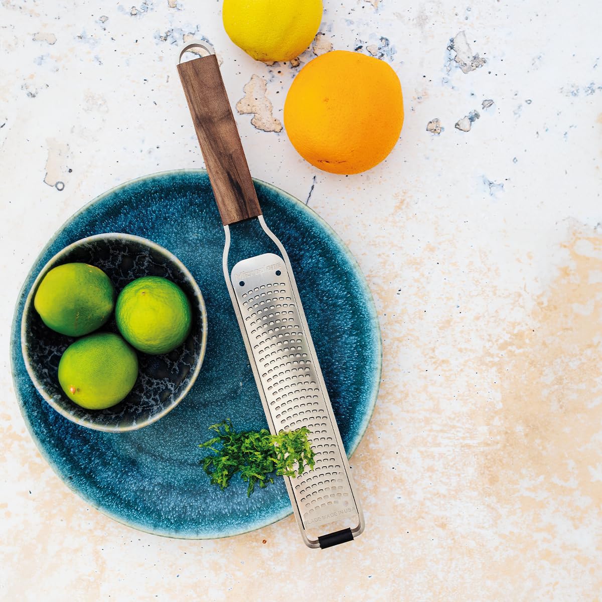 Microplane grated parmesan on plate shows fine, even cheese shavings