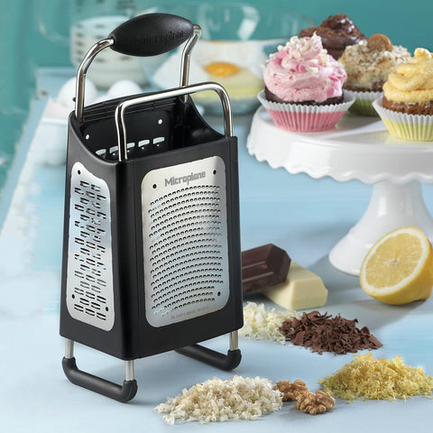 Microplane creating chocolate ribbons for desserts with neat presentation