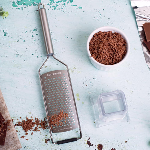 Microplane size comparison on countertop showing compact storage benefit