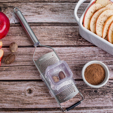 Microplane next to an egg to show scale and compact kitchen storage