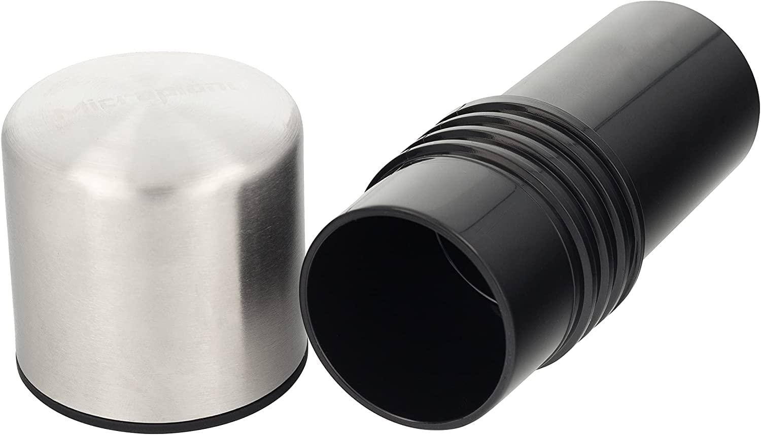 Microplane spice mill held in hand to show compact size and ergonomic comfort