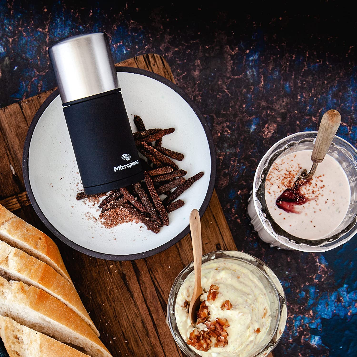 Microplane spice mill with silicone cover preventing mess and keeping counters tidy