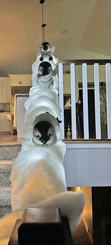 Midlee illuminated penguins glowing on stairs at night, creates cozy ambiance