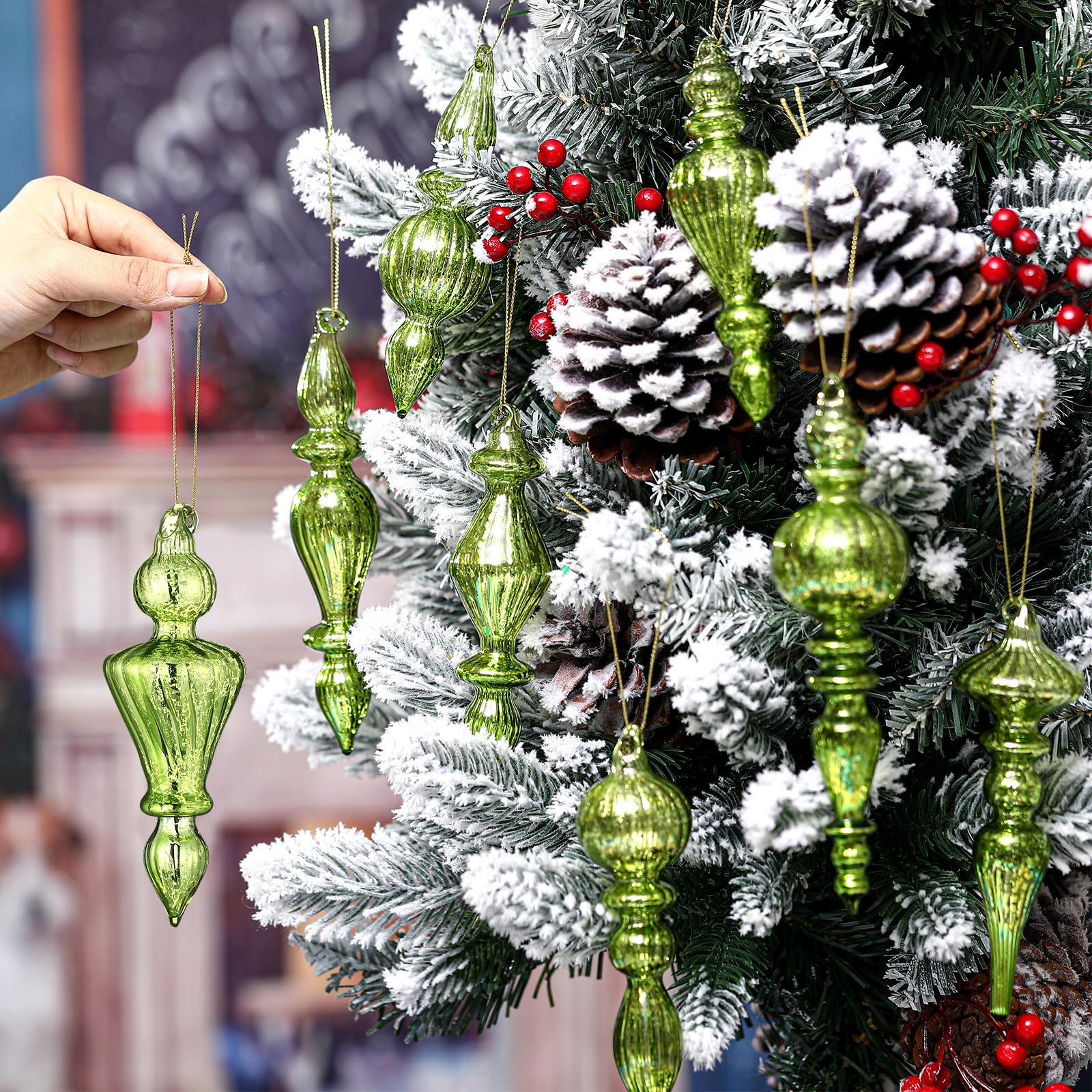 Mifoci finial held in hand to show 6-inch size and easy placement benefit