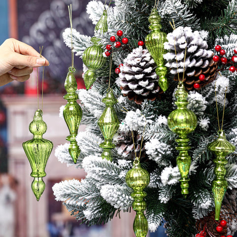 Mifoci finial held in hand to show 6-inch size and easy placement benefit