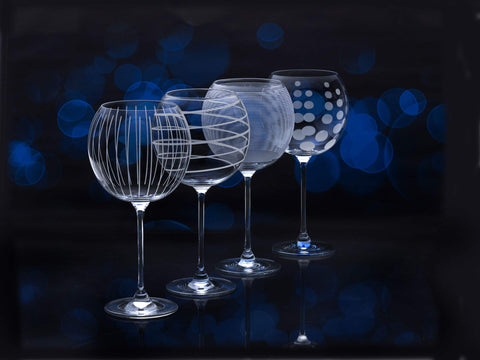 Mikasa Cheers goblet next to a bottle to show scale and ample 24.5-ounce capacity