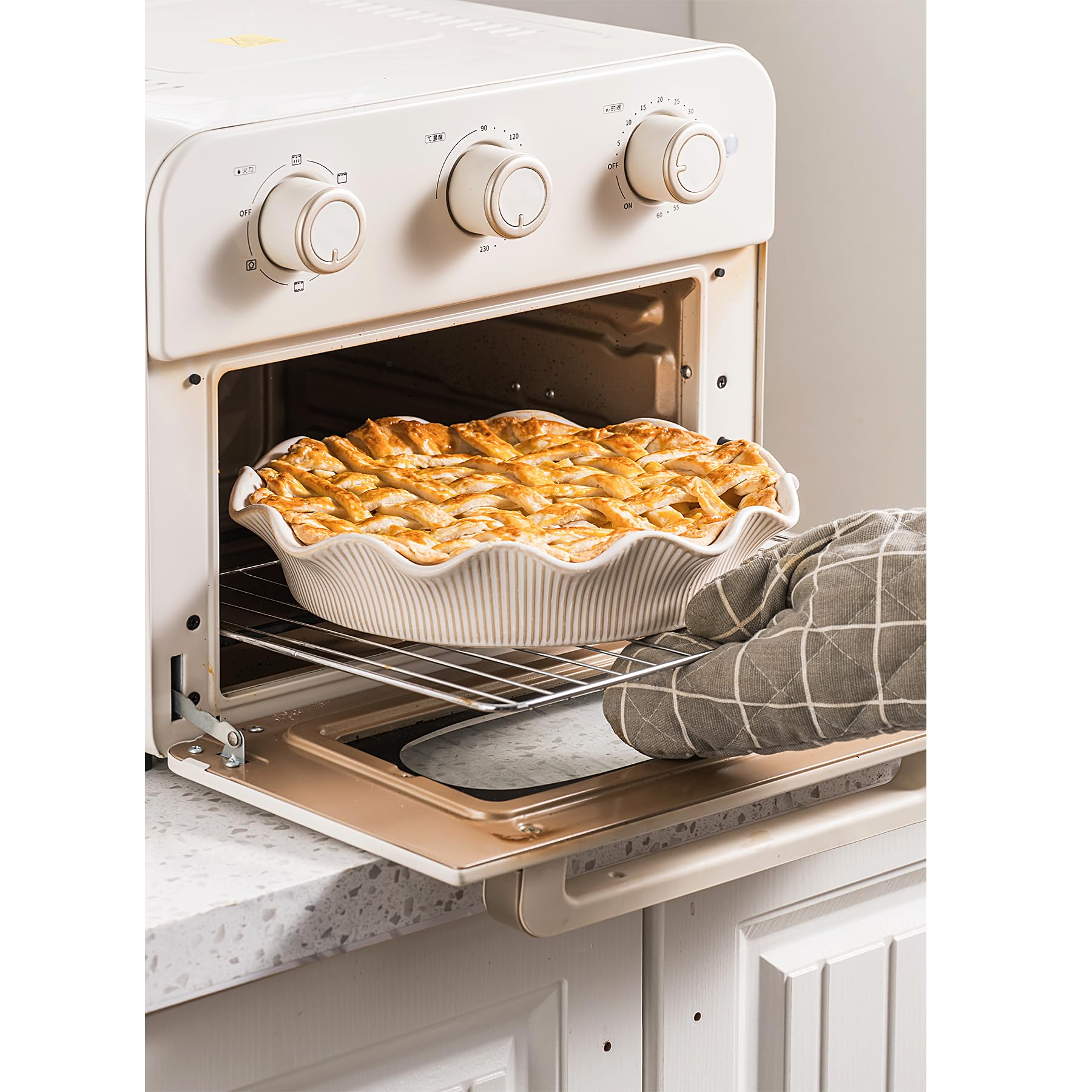MIKIGEY pie pan in oven with baking pie demonstrating even heat distribution benefit