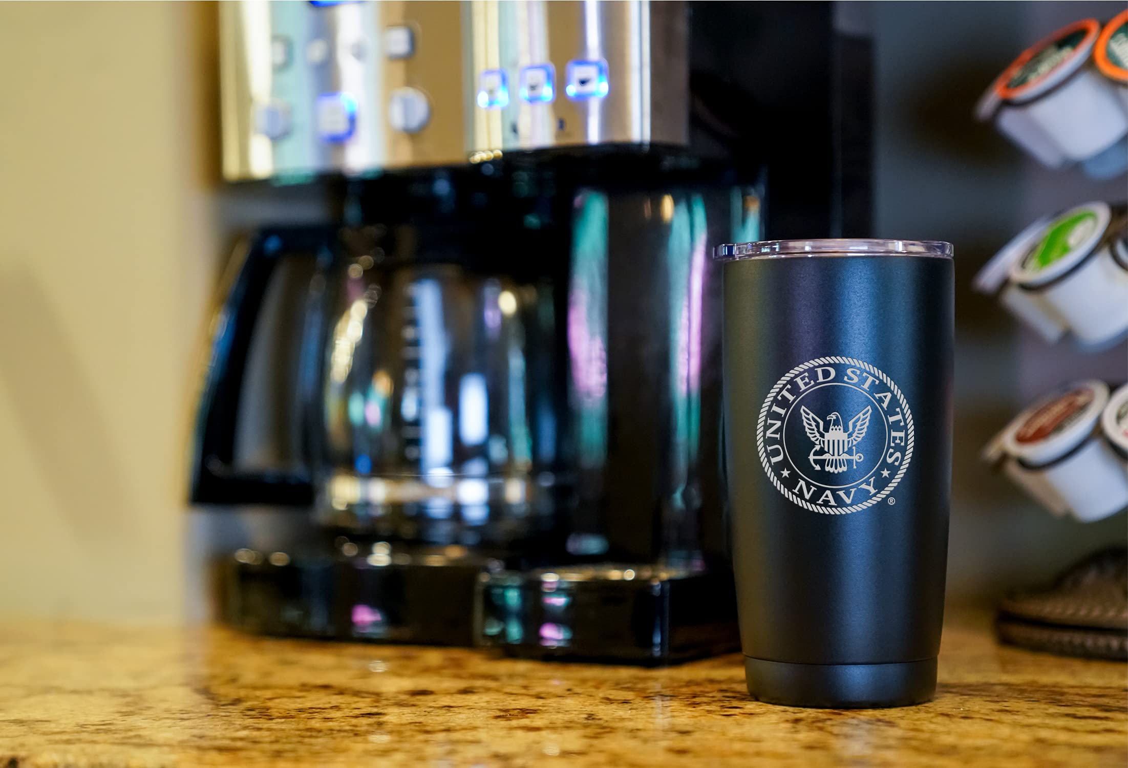 Military Gift Shop tumbler beside coffee and notebook showing everyday usability