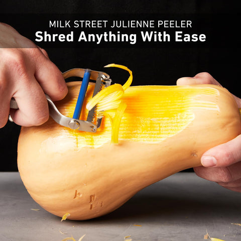 Milk Street julienne peeler next to replacement blade packet for easy maintenance and longevity