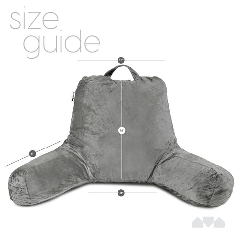 Milliard pillow in bed with person reading showing ergonomic support