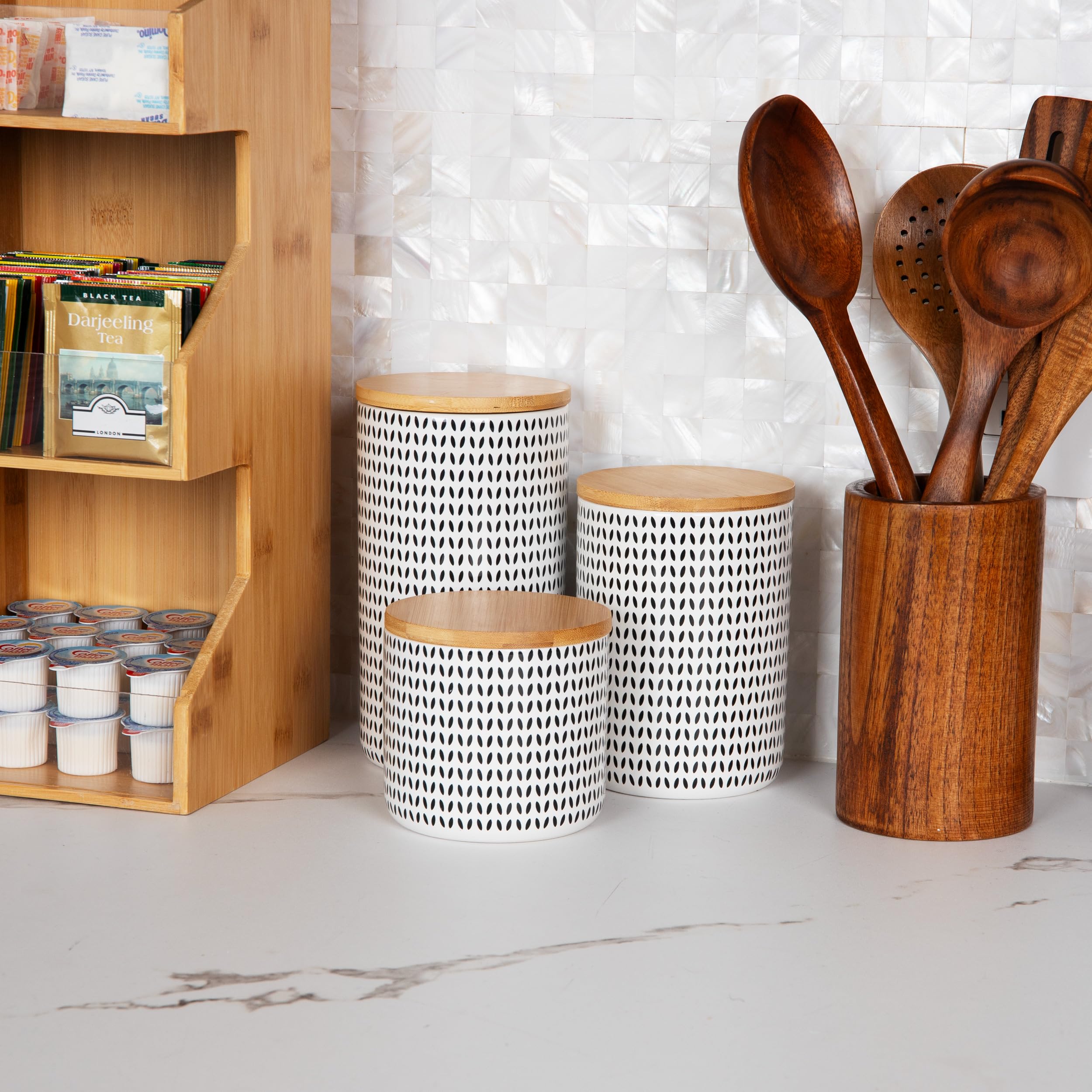 Mind Reader canister used in bathroom storing cotton balls for neat grooming