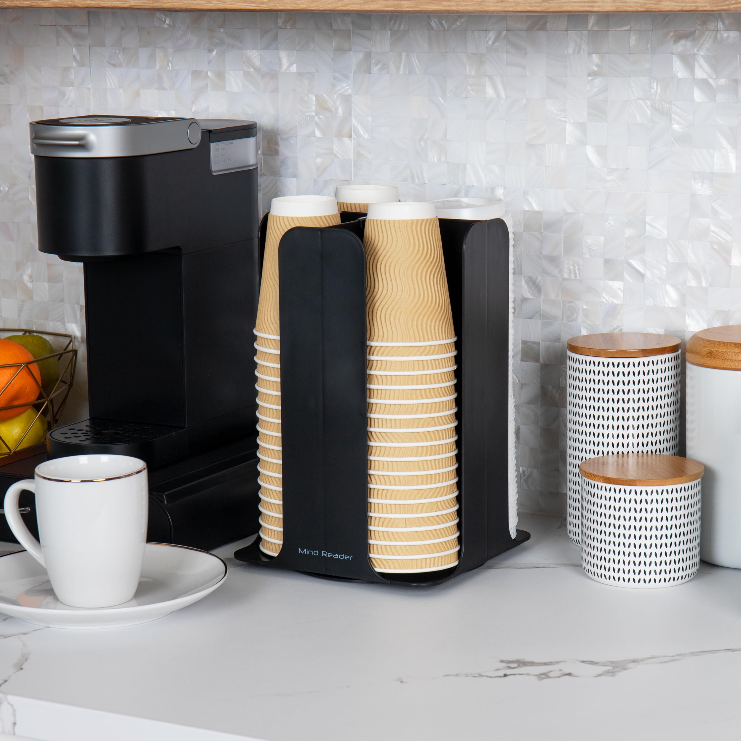 Mind Reader organizer next to mug demonstrating compact size and scale