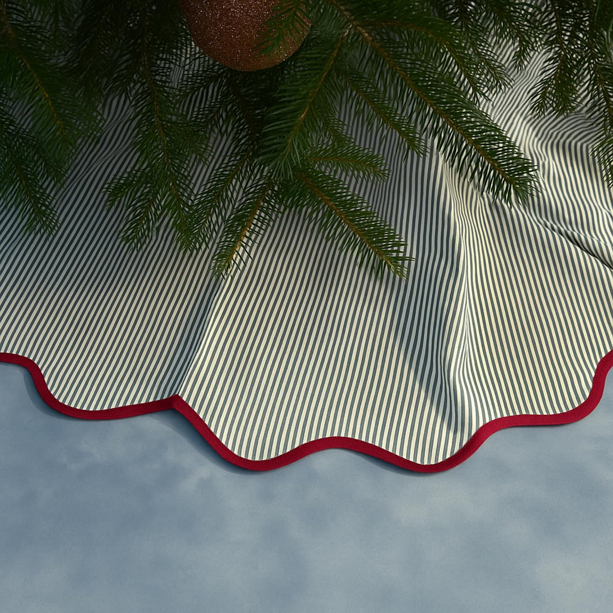MiniInflat tree skirt front view showing full green and red nature pattern and coverage
