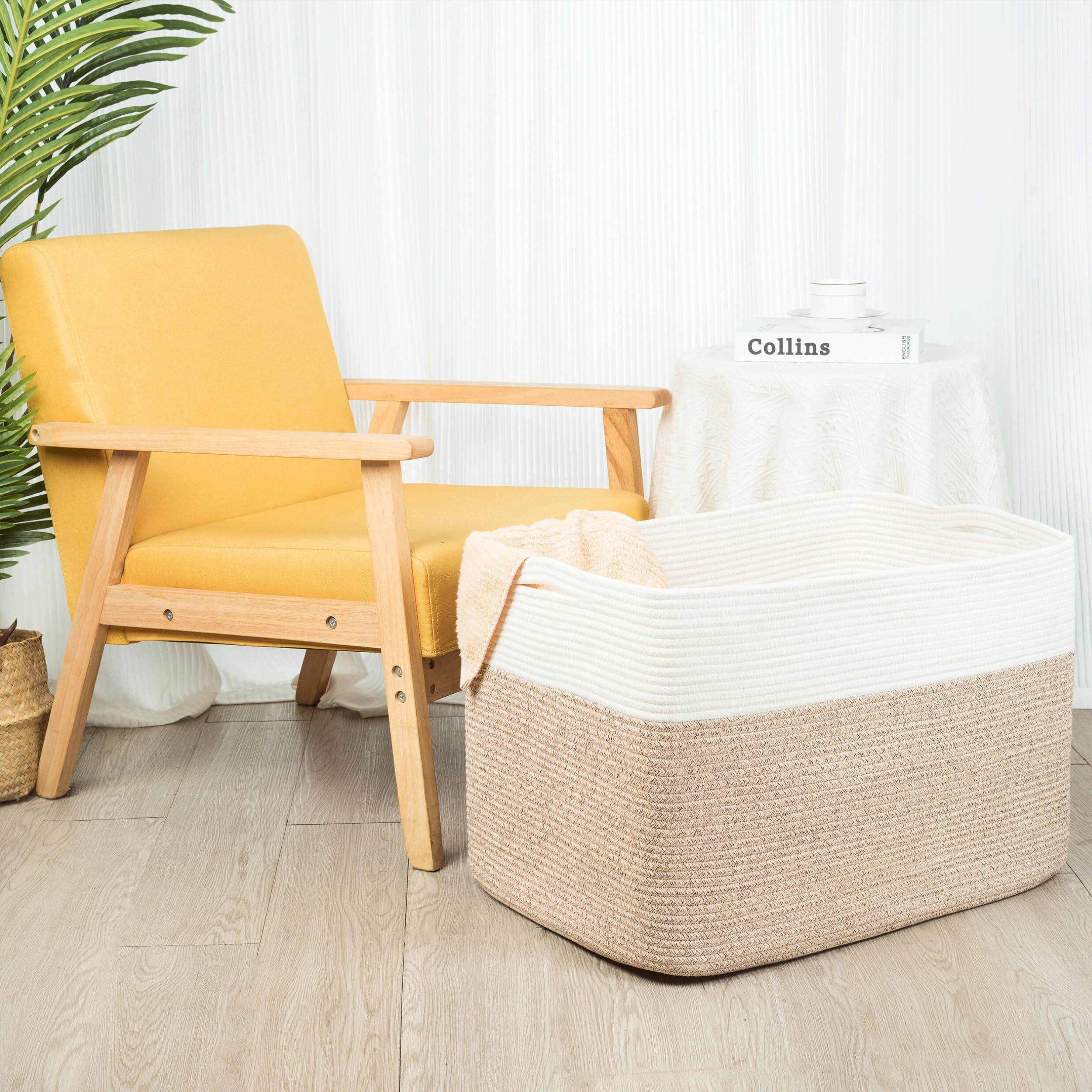 MINTWOOD Design basket filled with blankets in living room offering tidy, decorative storage