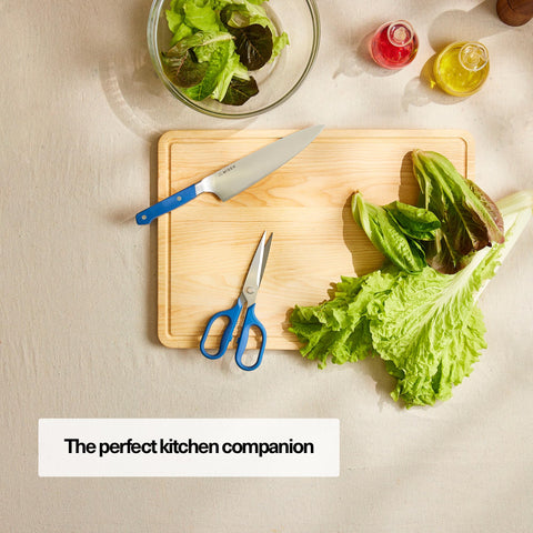 Misen close-up of micro-serrated blade edge delivering secure, precise cuts on slippery foods