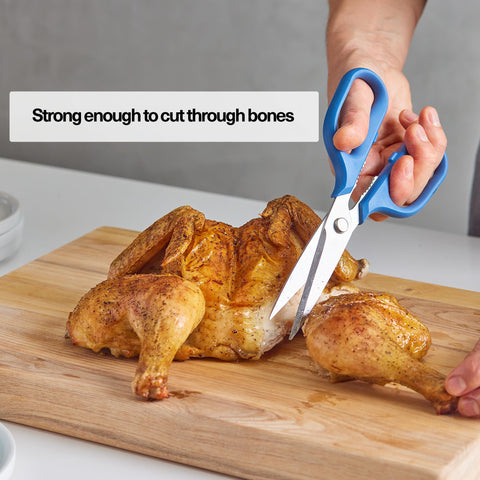 Misen snipping fresh herbs on a cutting board showing precise, bruise-free prep