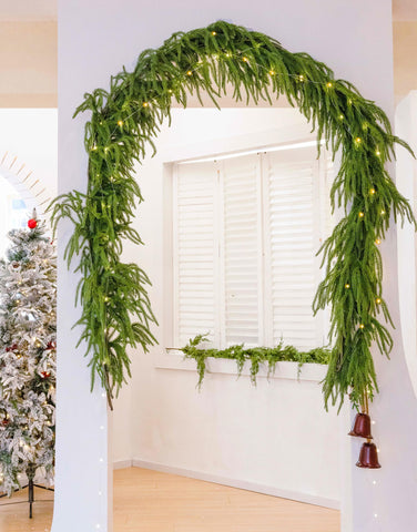 MISSPIN garland framing a doorway for outdoor covered entry charm