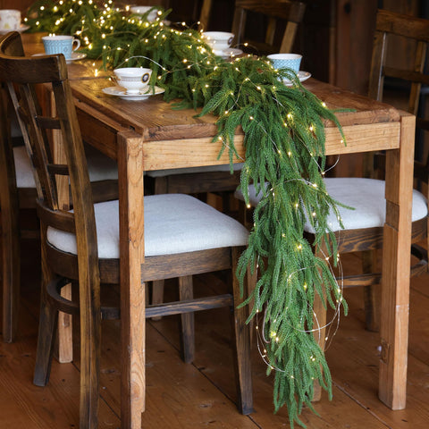 MISSPIN garland draped on mantel adding instant holiday warmth
