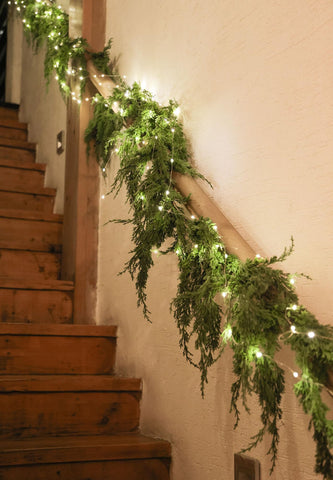 MISSPIN garland styled on mantel adding festive atmosphere