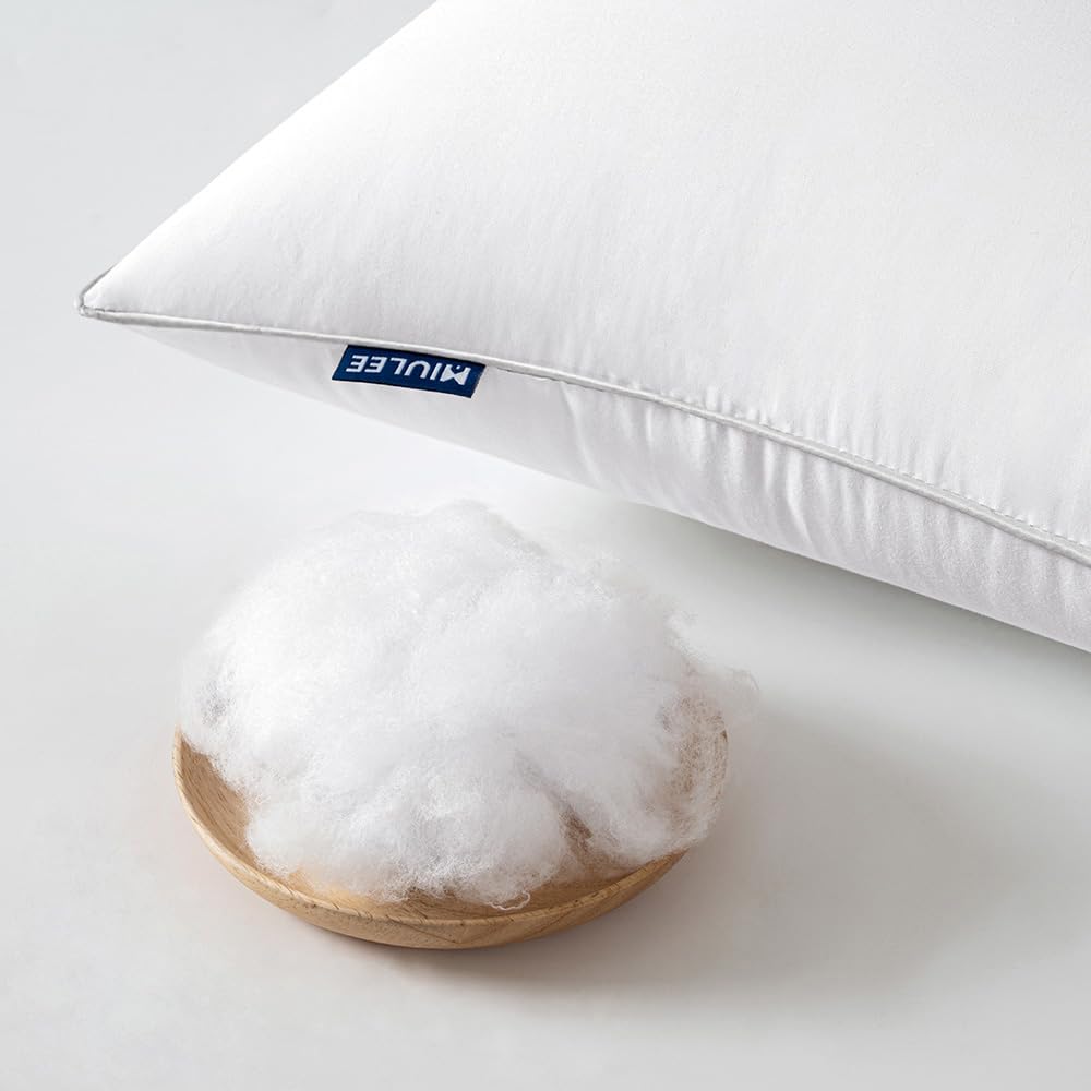 MIULEE hand pressing pillow corner showing resilient filling and supportive feel