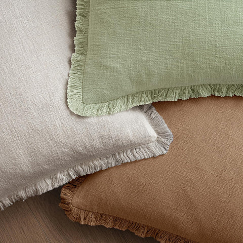 MIULEE pillow on sofa illustrating styling versatility and cozy atmosphere
