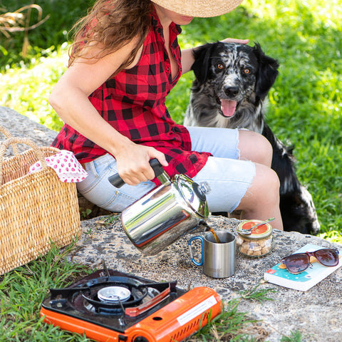 Mixpresso percolator brewing over a campfire for portable outdoor coffee enjoyment