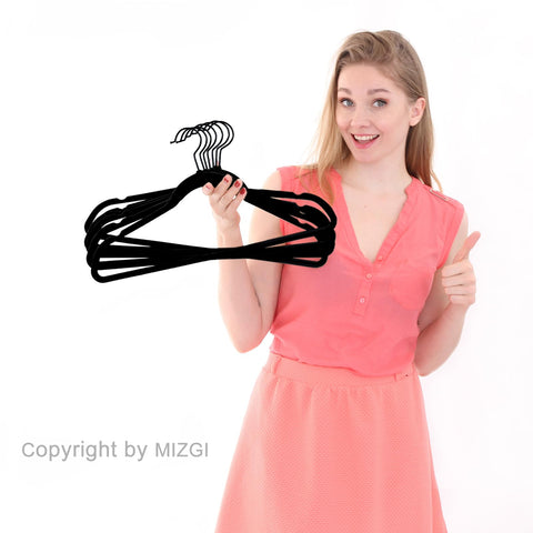 MIZGI bedroom scene with hangers creating tidy, boutique-style closet