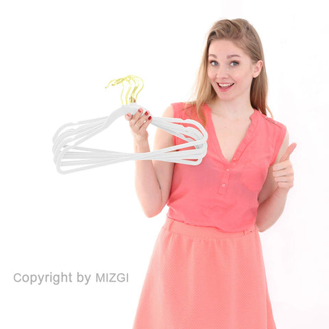 MIZGI hanger next to hand showing slim profile for maximizing closet space