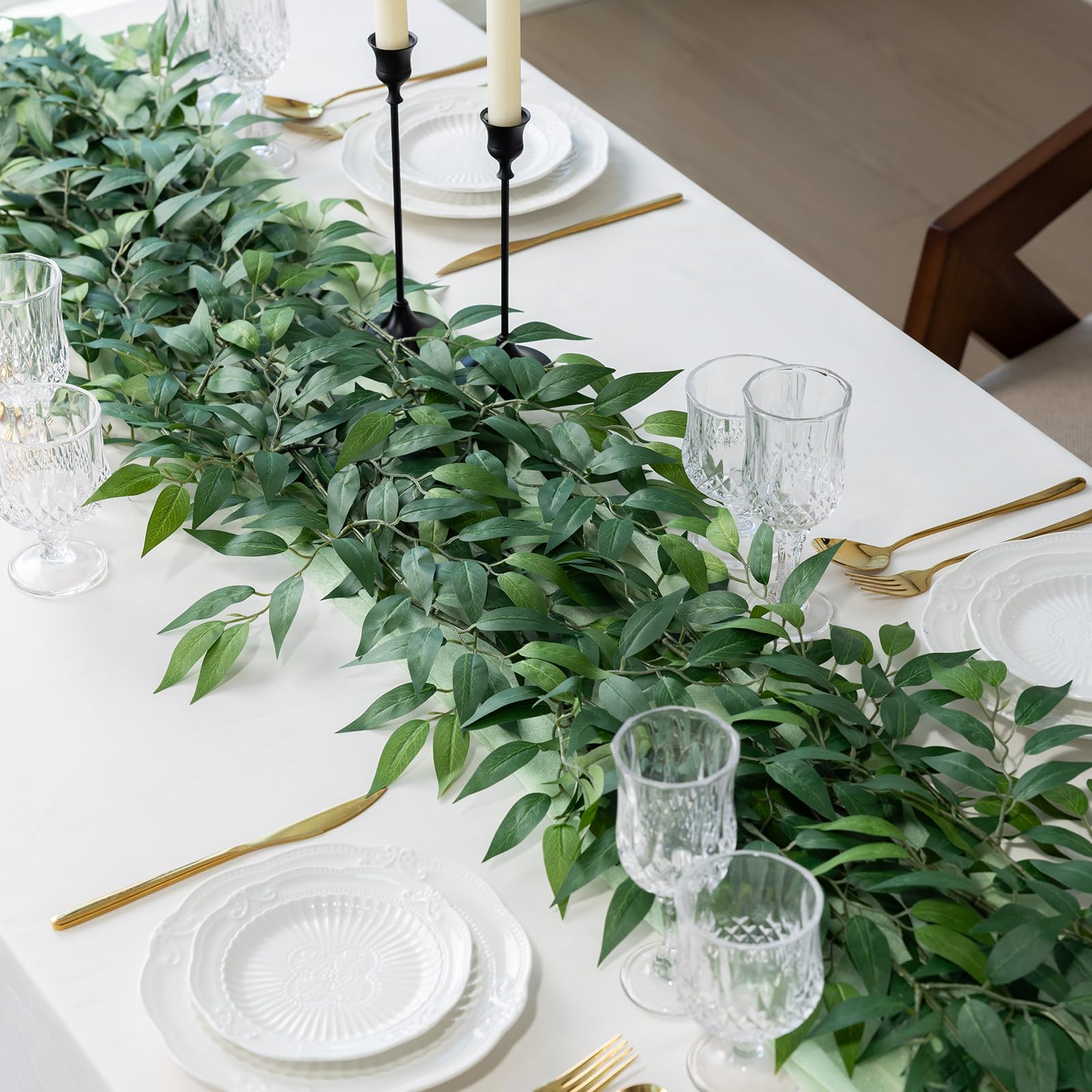 mizii greenery woven into a wedding arch adding lush, maintenance-free foliage