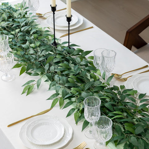 mizii greenery woven into a wedding arch adding lush, maintenance-free foliage