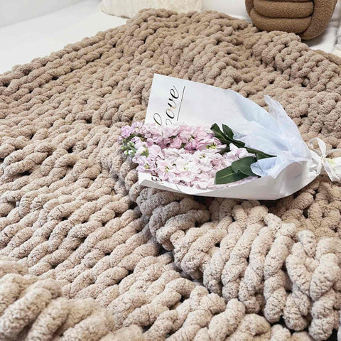MocaDng folded blanket at foot of bed adding layered bedding comfort and visual depth