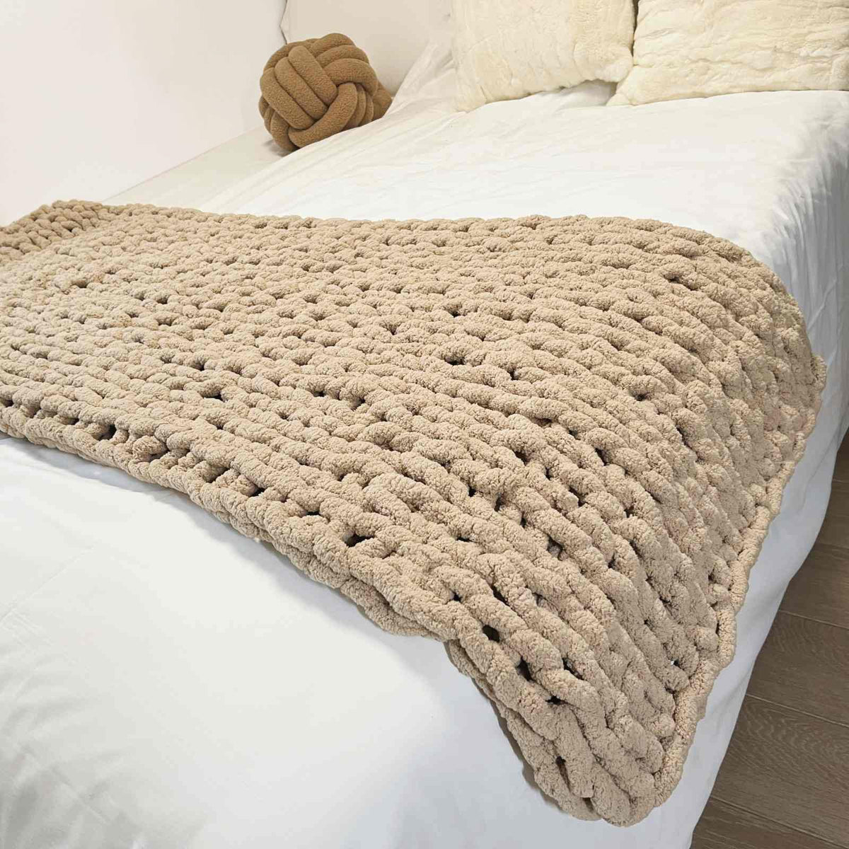 MocaDng front view of chunky knit throw on sofa showcasing cozy design and decor appeal