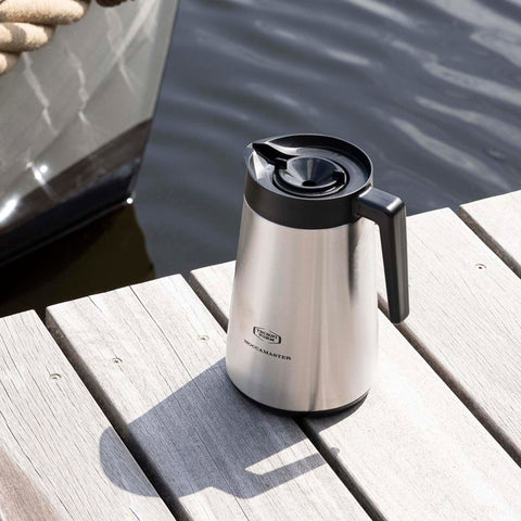 Moccamaster carafe in kitchen setting offering hot coffee for gatherings