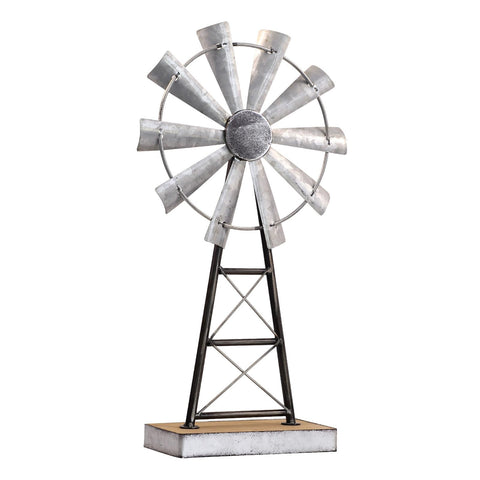 MODE HOME windmill next to book for scale showing compact vertical presence