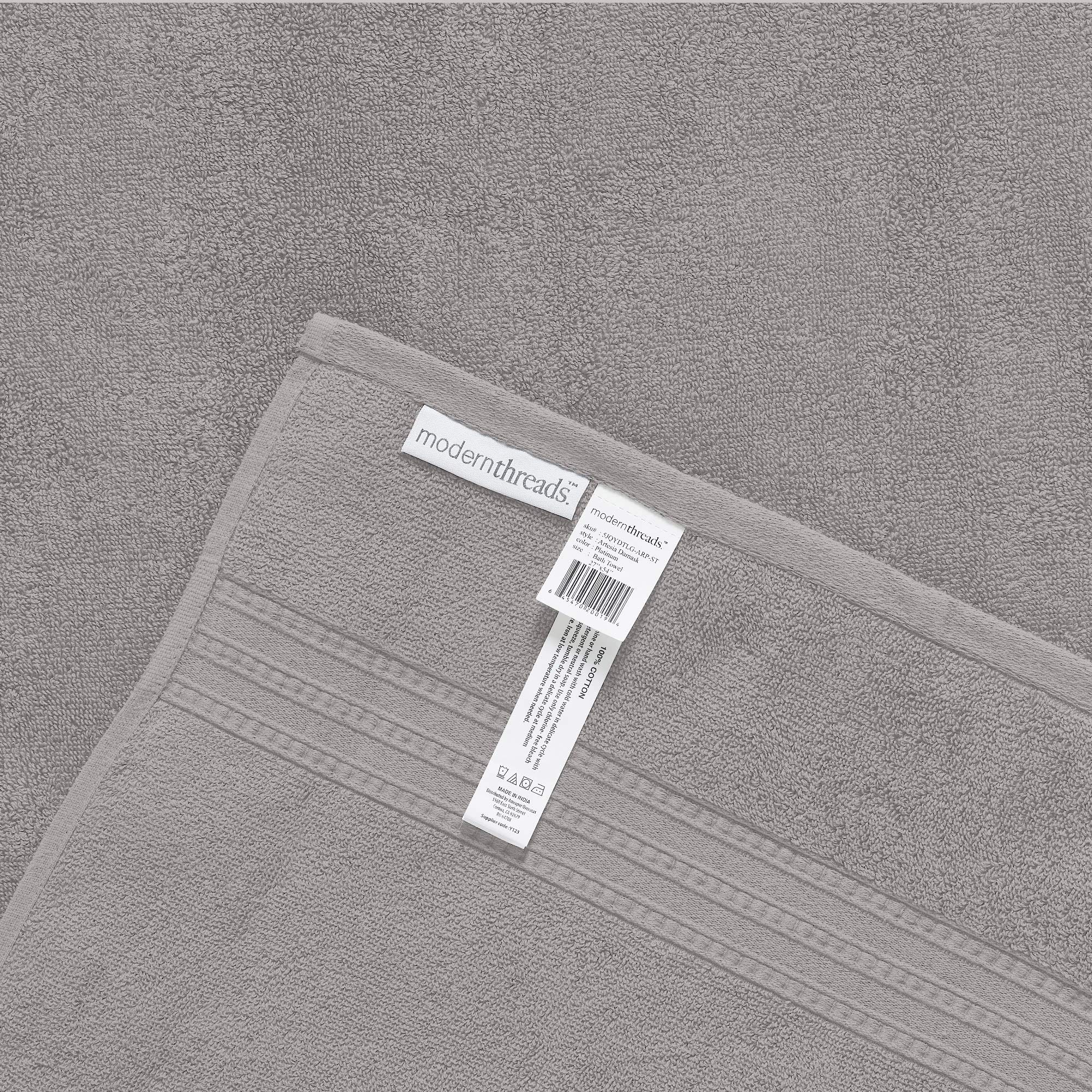 Modern Threads towels beside ruler illustrating bath, hand, and washcloth sizes for planning