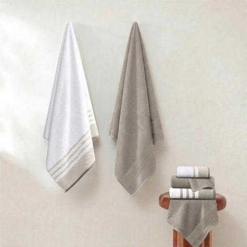 Modern Threads hand towel being used to dry hands demonstrating quick absorbency benefit