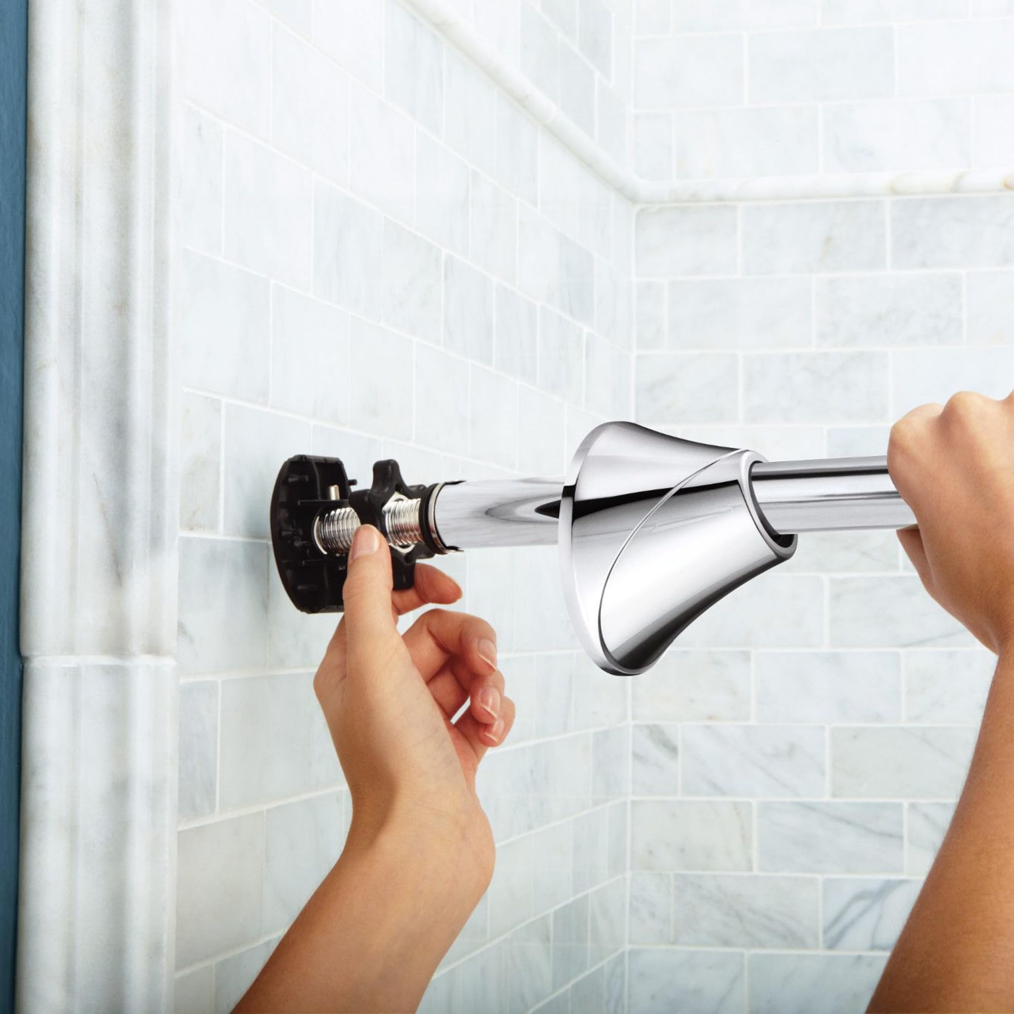 Moen curved rod chrome finish reflecting light for a polished bathroom accent